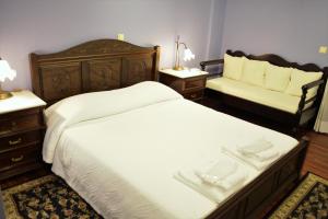 Postelja oz. postelje v sobi nastanitve Ilion Hotel