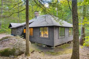 a small cabin in the woods with trees at Rustic Cabin w/ Squam Lake Access & Fireplace! in Holderness