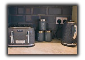 a group of appliances sitting next to each other at Pitchside Quarters Near Anfield sleeps 7 in Liverpool