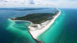 an aerial view of an island in the ocean at Tranquillity 140 - A Wave From It All in Inlet Beach