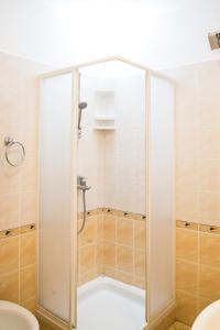 a shower with a glass door in a bathroom at Apartment Vesna Vabriga in Vabriga