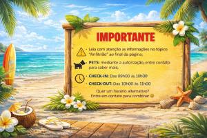 a sign on the beach with a surfboard at -TROPICAL SUÍTES- ao lado do SESC-BERTIOGA in Bertioga