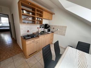 a kitchen with a sink and a counter top at Penzión Dvorec in Dvorec