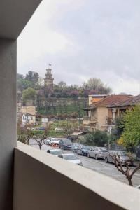 a view from a window of a street with cars at Alba Luxury Suite Trikala in Tríkala