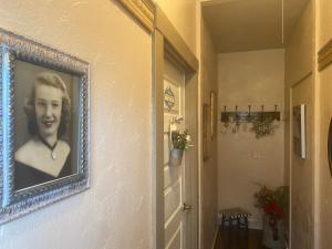 a picture of a woman hanging on a wall at IreneHouse Victorian INN in Sacramento