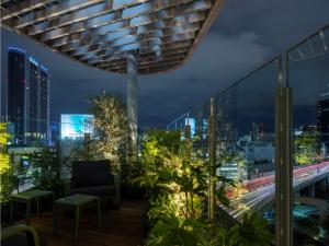 a balcony with a view of the city at night at toggle hotel suidobashi - Vacation STAY 06299v in Tokyo +16 photos