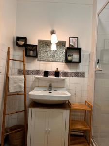 a bathroom with a sink and a shower at Chez Stella in Audierne +40 photos