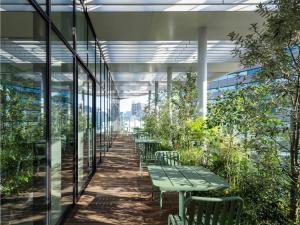 a long corridor with tables and chairs in a building at toggle hotel suidobashi - Vacation STAY 13410v in Tokyo