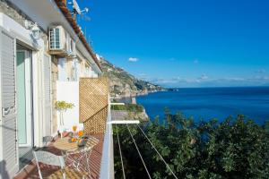 a balcony with a view of the ocean at Casa Delia in Praiano