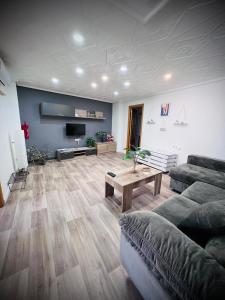 a living room with a couch and a table at Casa Sempere in Elche