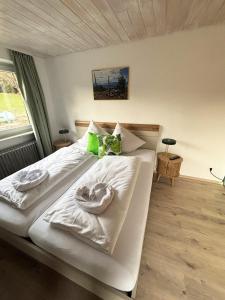 a bedroom with two beds with towels on them at pfefferHÄUSL in Regen