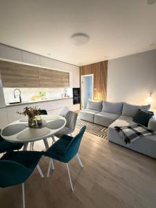 a living room with a couch and a table at Дивоніч guest house in Kyiv