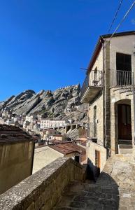 a view of a town with a mountain in the background at La Pietra Verde in Pietrapertosa