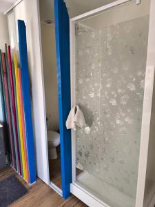 a glass shower door with a reflection of a toilet at La Bruyère - B & B - in Tréban +60 photos
