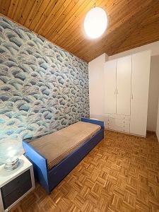 a room with a bed with a mural on the wall at Ca' di Romagna B&B in Civitella di Romagna