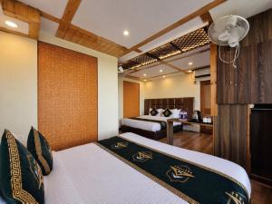 a bedroom with a bed and a desk at Anandam Near Mall Road in Shimla