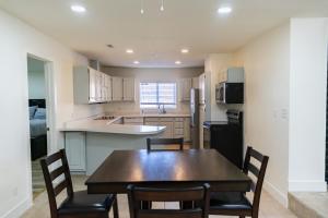 a kitchen with a wooden table and chairs in it at Duchesne River LLC in Duchesne