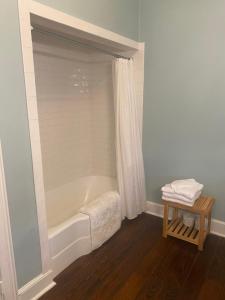 a bathroom with a bath tub and a table at Ormond Manor in Destrehan +35 photos