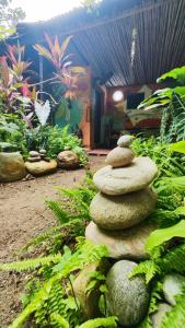 a pile of rocks sitting on top of a garden at Camping watiwara in Buritaca