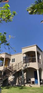 a large white building with balconies on it at Home Escape Negril Unit 3 in Negril