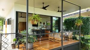 a kitchen and dining room with potted plants at River Lodge - a Luxurious Hideway in the Jungle in Uvita