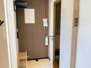 a door leading to a hallway with a room at 4 star holiday home in SÖLVESBORG in Sölvesborg