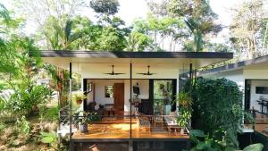a modern house with a glass facade at River Lodge - a Luxurious Hideway in the Jungle in Uvita