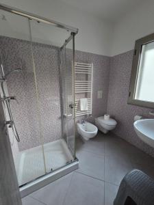 a bathroom with a shower and a sink at Hotel Rodian in Acquappesa +20 photos