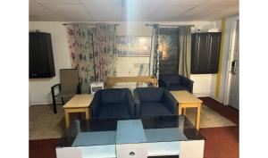 a living room with a couch and a table at CMI Hotel 1935 Myrtle Beach SC in Myrtle Beach