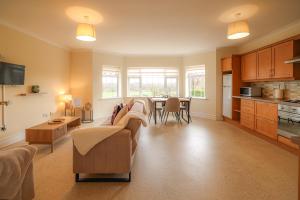 a living room with a couch and a table at Hillside House- Pine View in Ballinamuck +10 photos