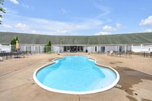 a large swimming pool in front of a building at Indiana Beach Hotel in Monticello