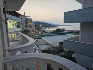 a balcony of a building with a view of the water at Hotel Bar Pizzeria Verona in Ksamil