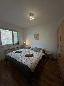 a bedroom with a large bed in a room at Apartmán pod Čebraťom in Ružomberok