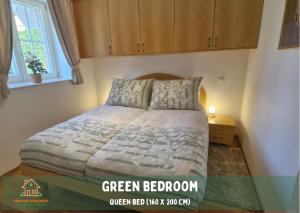 a bedroom with a bed and a window at Pardubsky Apartments in Ljubljana