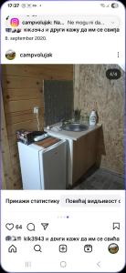 a kitchen with a sink and a refrigerator at Camp Volujak in Gacko