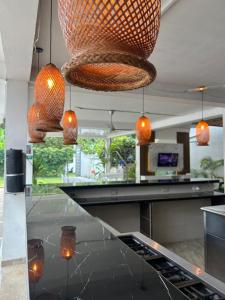 a kitchen with pendant lights and a counter at CASA VACACIONAL CAMPOSOL in Melgar