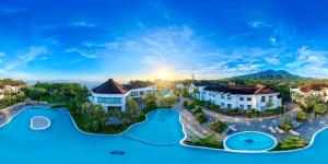 an aerial view of a resort with two pools at Hotel Palma Real in Sambo Creek