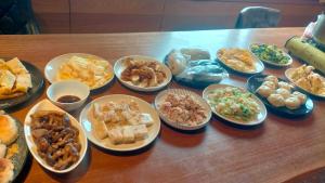 a table with a bunch of different types of food at After the Court Chiaohsi in Jiaoxi