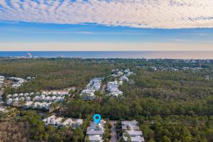 an aerial view of a city with trees and houses at SeaPines on 30A in Santa Rosa Beach