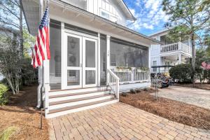 a house with an american flag on the front porch at SeaPines on 30A in Santa Rosa Beach