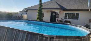 a large swimming pool in front of a house at Cabañas Privadas San Carlos Escape & Relax in Ensenada