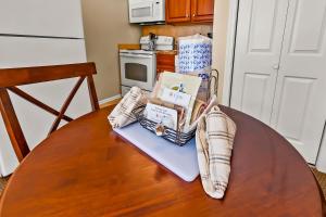 a table with a bunch of items on it in a kitchen at Cozy 1st floor condo with golf course view in New Bern