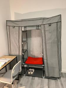 a room with a bed with a desk and a chair at Chambre spacieuse - appart sympa chez l'habitant in Saint-Herblain