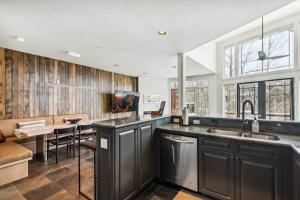 a kitchen with a sink and a counter top at Pine Meadows 135 ~ Pine Meadows 135 in Telluride +40 photos