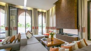 a living room with a couch and a table at Dreamcation Villa in Marrakesh