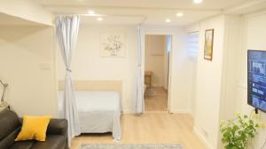 a living room with a couch and a table at Applewood Gardens Apartment in Mississauga +8 photos