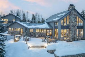 a home in the winter with snow on the ground at Benchmark Dr 101 in Telluride