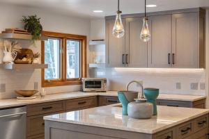 a kitchen with a sink and a counter top at Benchmark Dr 101 in Telluride +42 photos