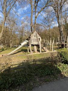 a playground in a park with a large pipe at Ellis Häusle in Nagold