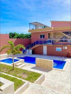 a house with a swimming pool in front of it at Villa Barias in Baní